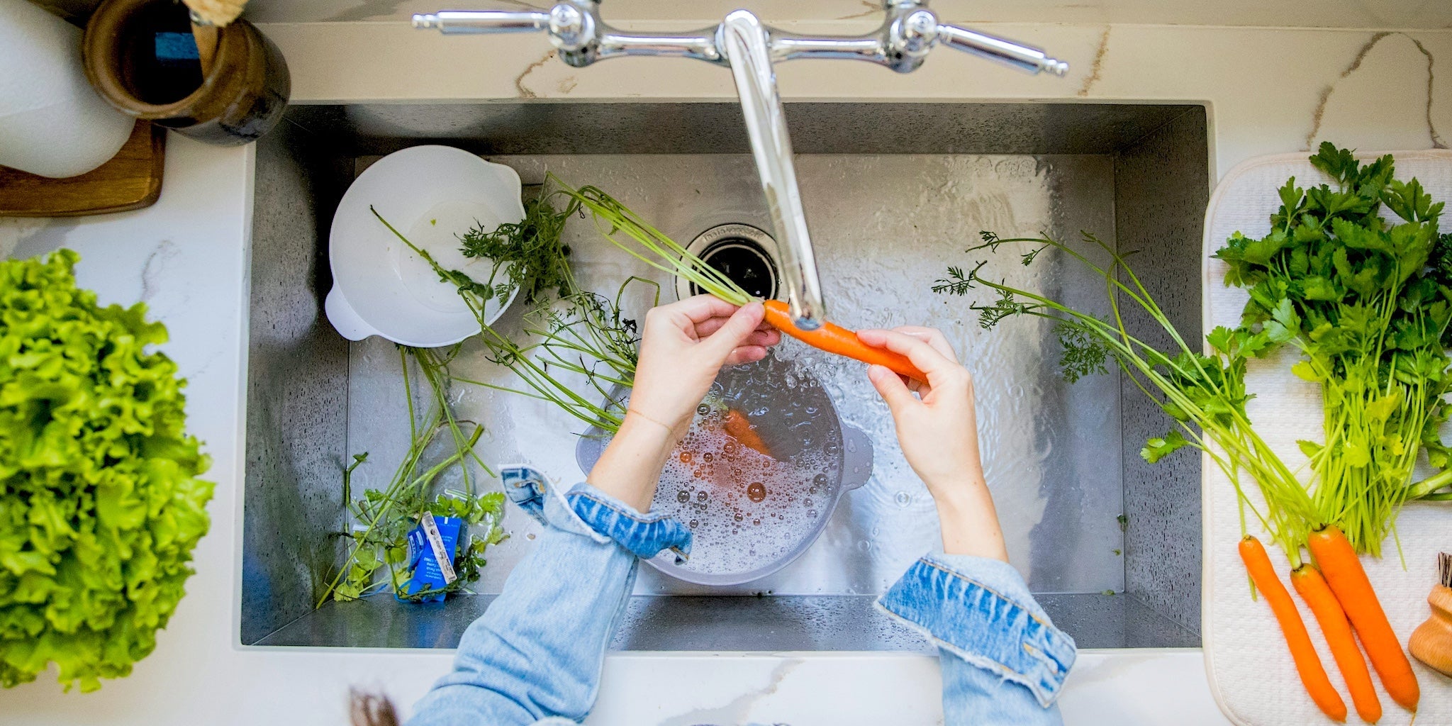 CSA vegetables being washed under running water—fresh from The Boreal Farm